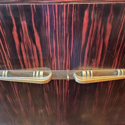 1920s Art Deco macasser ebony sideboard with brass mounts and a marble top, French