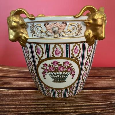 19th century Dresden porcelain cachepot, decorated with flowers and rams’ heads