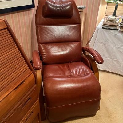 Andrew LeBlanc brown leather and wood recliner, very modern and elegant, sleek design, not  so bulky
