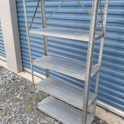 5 metal shelf  $7.50
Measures 57 1/2 inches tall x 11 1/2 inches deep and 29 1/2 inches wide