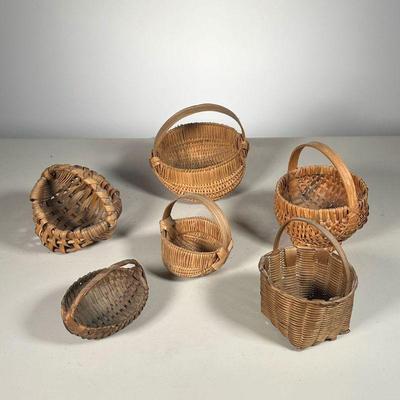 (6PC) SMALL BASKETS | Including: (5) Handled baskets; and (1) Buttocks Basket PA, c. 1950s with Provenance receipt. - l. 4.25 x w. 3.25 x...