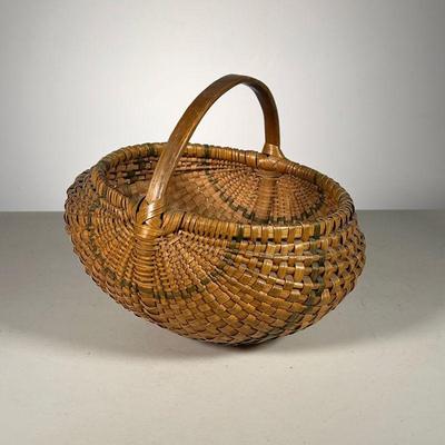 GREEN PAINTED MELON BASKET | Nice Melon shaped basket with green painted hi light bands. Great Color. Receipt from 1991. - l. 12 x w. 10...