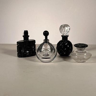(4PC) BLACK GLASS PERFUME BOTTLES | Both cut and blown black glass perfume bottles. - h. 4.5 x dia. 2.5 in (largest)

