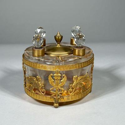 GILT PERFUME BOTTLES SET | 4 Curved flacons containing perfume in gilt holder. - h. 5 x dia. 5 in

