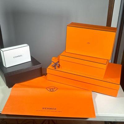 (8PC) LOT OF HERMES & CHANEL EMPTY BOXES/BAGS | Mixed lot of 8 empty luxury item boxes, featuring 2 Chanel boxes, 3 Hermes boxes, 2...