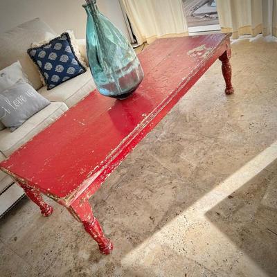 Oversized distressed red coffee table from Washburn Imports
