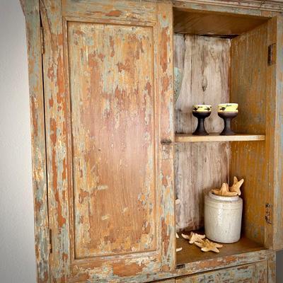 Warm-toned distressed china cabinet from Washburn Imports (36