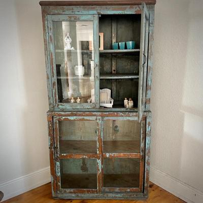 Blue distressed glass display cabinet from Washburn Imports