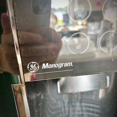Black GE Monogram side by side refrigerator with ice maker
