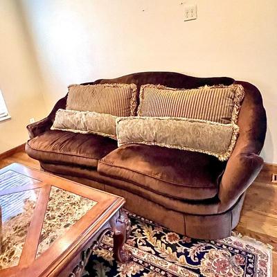 Lovely velvet couch with coordinating pillows 