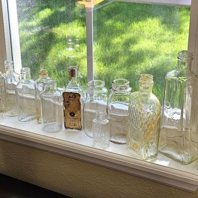 Assorted clear glass flask Bottles
