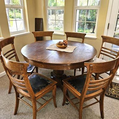 Round Antique Table on castors w/ one Leaf