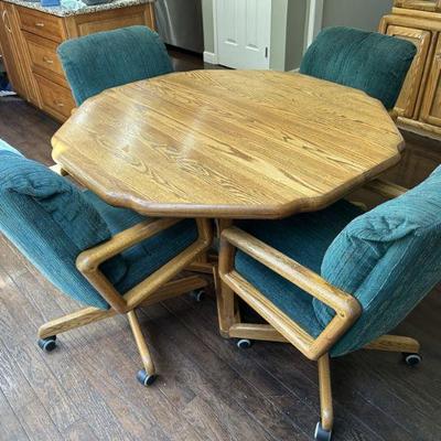 Casual solid oak table  with 4 comfy chairs on wheels