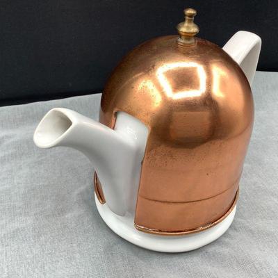 Copper cozy on tea pot