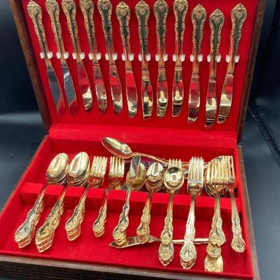 Gold tone flatware set with box