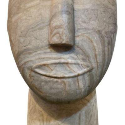 Surrealist Stone Face Sculpture

