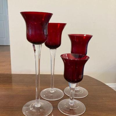 Assorted red glass candle-holders