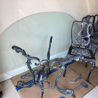 Wrought iron patio set: table with glass-top and four chairs