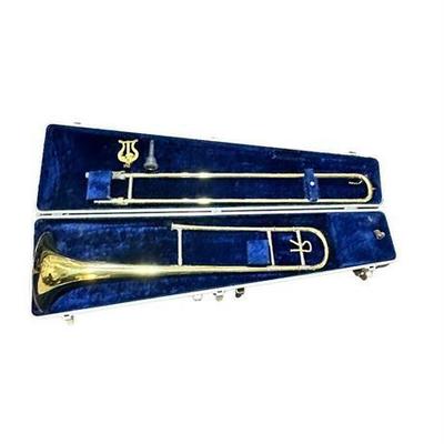 Lot 839   
Vintage Vincent Bach Corp Brass Trombone with Case