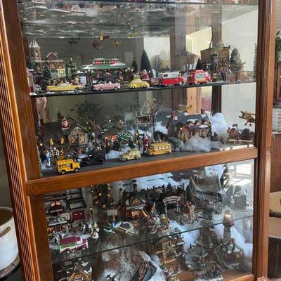 Large collection of Dept 56 buildings, people and accessories.