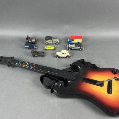 Lot 431 | Guitar Hero Wireless Controller and Toy Cars