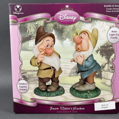 Lot 451 | Bashful and Sneezy Garden Statues Snow White Set