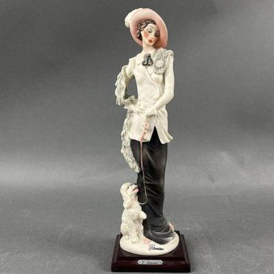 Lot 557 | G. Armani Statue Lady with Poodle