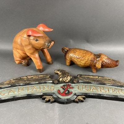 Lot 425 | Wood Carvings Two Pigs and Eagle Sign