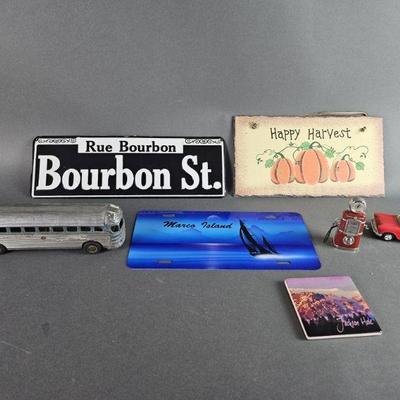 Lot 79 | Metal Signs, Vintage Tin Toys, and More