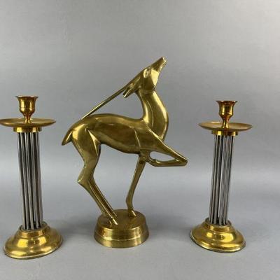 Lot 526 | MCM Brass Gazelle & Post Modern Candle Holders
