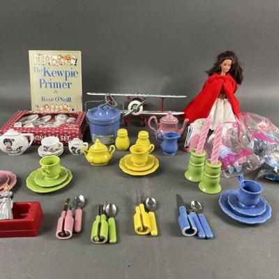 Lot 464 | Toy Tea Sets, Dolls, Die Cast Plane & Kewpie Book
