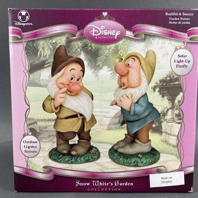 Lot 450 | Bashful and Sneezy Garden Statues Snow White Set