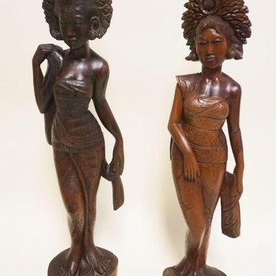 1051	2 LARGE ASIAN WOOD CARVINGS OF WOMEN, TALLEST APPROXIMATELY 24 IN HIGH

