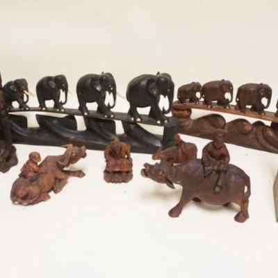 1053	LARGE GROUP OF ASIAN WOOD CARVINGS, MOST HAVE LOSS TO INSET EYES & TUSKS, TALLEST APPROXIMATELY 13 IN HIGH
