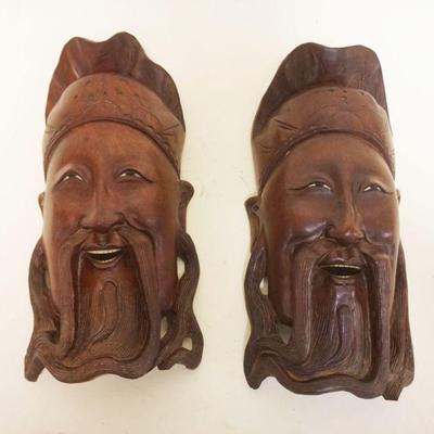 1048	PAIR OF WOOD CARVED ASIAN MASKS W/INSET SHELL EYES & TEETH, EACH APPROXIMATELY 12 IN
