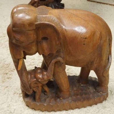 1081	CARVED WOOD ELEPHANT W/BABY ELEPHANT, APPROXIMATELY 21 IN X 12 IN X 25 IN HIGH
