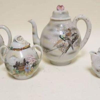 1034	GROUP OF ASSORTED KUTANI TEAPOTS, CREAMERS, SUGARS, TALLEST 8 IN
