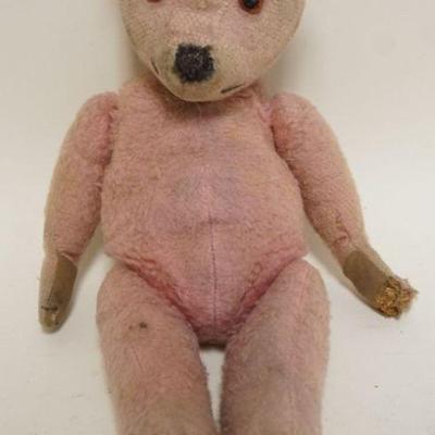 1190	ANTIQUE MOHAIR JOINTED TEDDY BEAR WITH GLASS EYES, APPROXIMATELY 16 IN H, WEAR TO MOHAIR WITH SOME LOSS
