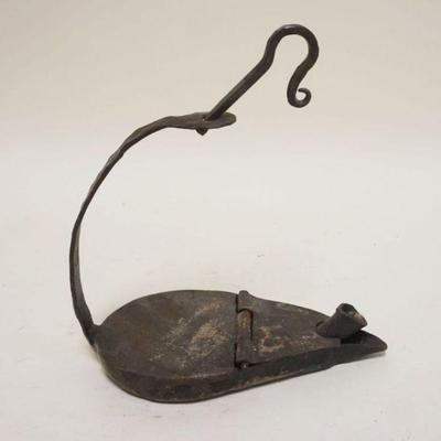 1242	PRIMITIVE WROUGHT IRON BETTY LAMP, APPROXIMATELY 9 IN X 4 1/2 IN X 7 IN HIGH
