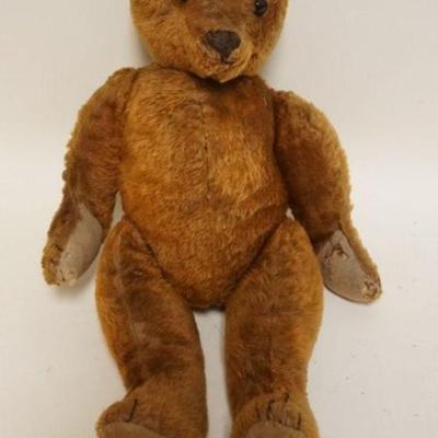 1194	ANTIQUE MOHAIR JOINTED TEDDY BEAR WITH GLASS EYES, APPROXIMATELY 21 IN H, EARS MISSING
