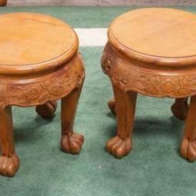 1062	SET OF 4 CARVED WOOD ASIAN STANDS ON PAW FOOT, EACH APPROXIMATELY 13 1/4 IN X 13 1/2 IN HIGH
