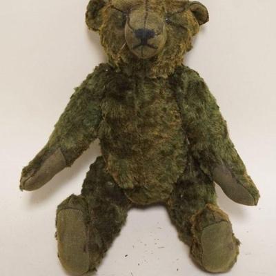 1187	ANTIQUE GREEN MOHAIR JOINTED TEDDY BEAR WITH GLASS EYES AND SWIVEL NECK, APPROXIMATELY 13 IN H
