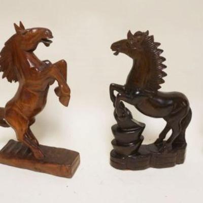 1060	GROUP OF 4 CARVED WOOD REARING HORSES, EACH APPROXIMATELY 13 IN HIGH
