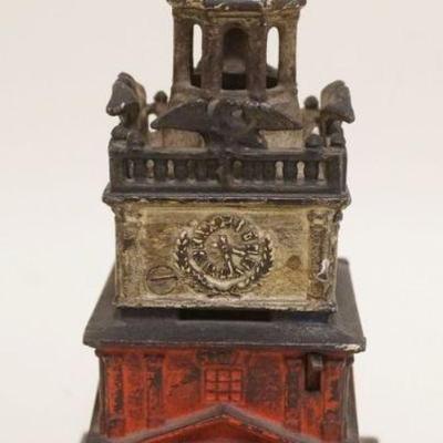1198	ANTIQUE CAST IRON BANK, CLOCK, APPROXIMATELY 8 1/2 IN H *INDEPENDENCE HALL*, BANK HAS DAMAGE TO TOP TOWER. BANK HAS LEVER FOR BELL...