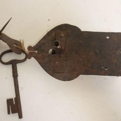 1215	LARGE ANTIQUE HAND FORGED METAL LOCK AND KEY, APPROXIMATELY 4 1/2 IN X 7 IN
