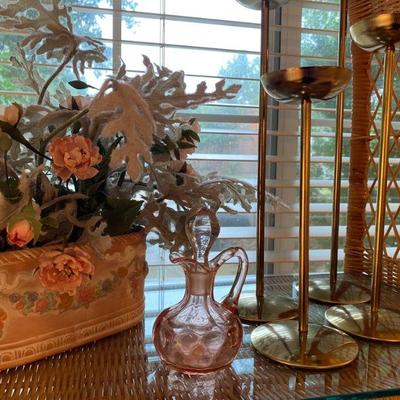 Decoratives including floral arrangements and brass candlesticks