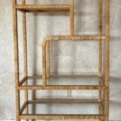 Vintage Milo Baughman-Style Etagère

Beautiful! This Magnificent Mid Century Shelf features a wicker wrapped frame paired with glass...