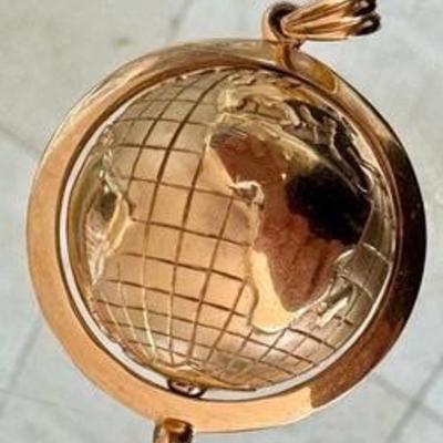 14k Gold Rotating Globe Pendant, measuring just under 1.5 inches. 

Weight about 23.92 grams. 