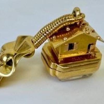 Vintage Bucherer 14k Watch Pin featuring an adorable house figurine. 

Item not tested. 
