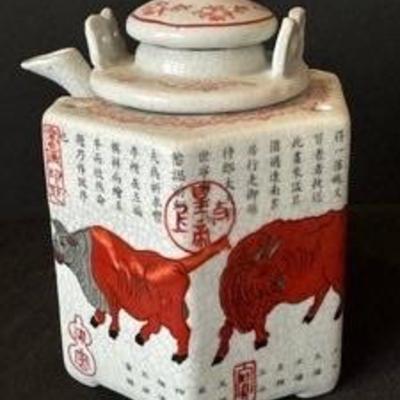 Vintage Chinese Hexagonal Teapot

Featuring five (5) oxen with calligraphy and red seals in the style of Han Huang